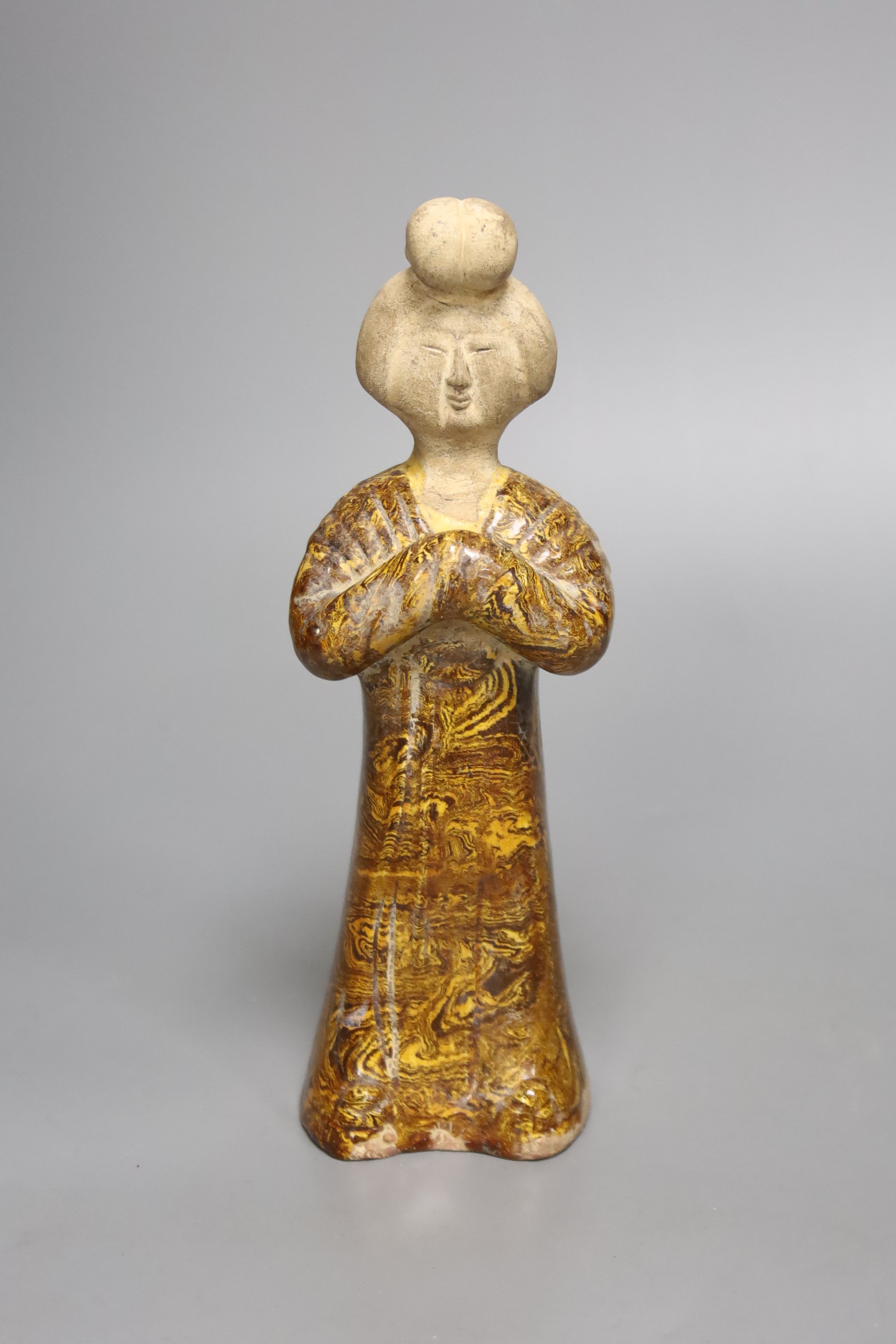 A standing pottery figure of an aristocratic Chinese lady, rare marbled clay, Tang dynasty or later, 20cm high